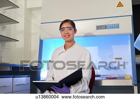 Portrait of scientist in laboratory looking at camera View Large Photo Image Picture - Portrait of scientist in laboratory looking at camera. Fotosearch