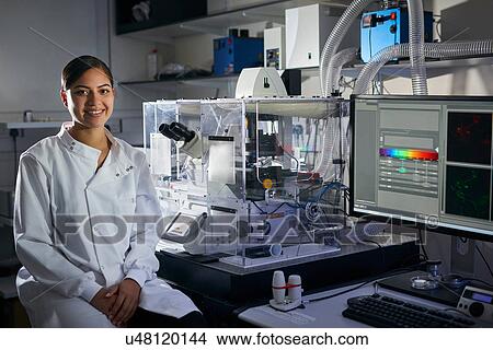 Picture - Portrait of scientist in laboratory looking at camera smiling. Fotosearch