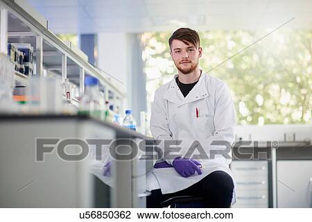 Stock Image - Portrait of scientist in laboratory looking at camera. Fotosearch