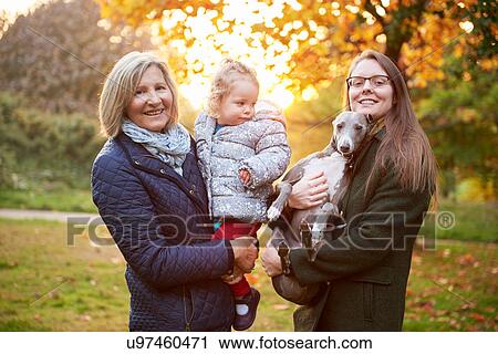 Portrait of senior woman with daughter, granddaughter and dog in autumn park View Large Photo Image Stock Image - Portrait of senior woman with daughter, granddaughter and dog in autumn park. Fotosearch