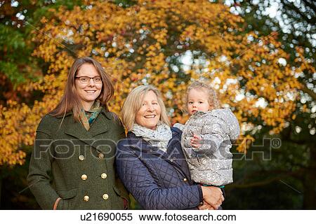 Portrait of senior woman with daughter and granddaughter in autumn park View Large Photo Image Stock Photography - Portrait of senior woman with daughter and granddaughter in autumn park. Fotosearch