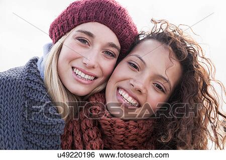Portrait of two young female friends at beach, Western Cape, South Africa View Large Photo Image Stock Photograph - Portrait of two young female friends at beach, Western Cape, South Africa. Fotosearch