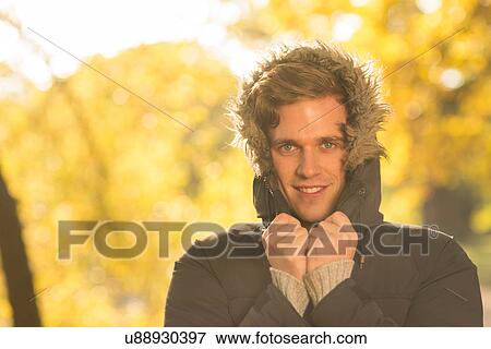 Portrait of young man with hood up, in rural setting View Large Photo Image Stock Photo - Portrait of young man with hood up, in rural setting. Fotosearch