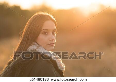 Stock Photograph - Portrait of young woman in rural setting. Fotosearch