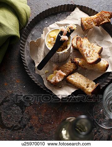 Stock Image - Potted shrimp with toasted bread. Fotosearch