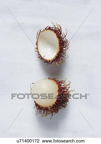 Stock Image - Rambutan (Nephelium lappaceum) fruit against white background. Fotosearch