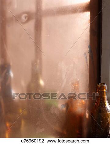 Stock Image - Reflection of wine bottles in mirror. Fotosearch
