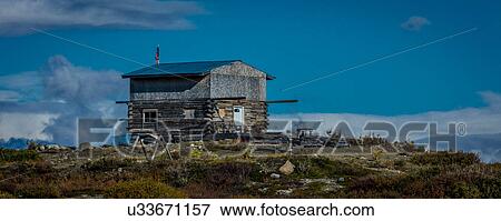Stock Photo - Remote Cabin along Denali Highway, Route 8, offers views of Mt. Deborah, Mnt. Hess Mountain, & Mt. Hayes Alaska, Alaska. Fotosearch