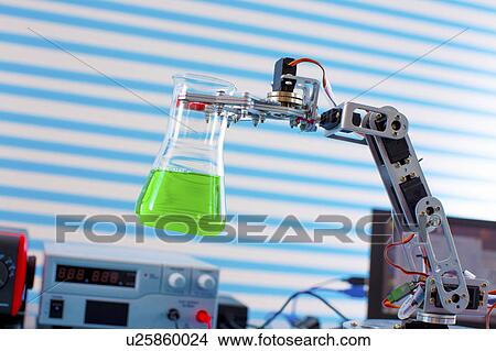 Picture - Robotic arm holding chemical flask. Fotosearch
