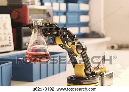Robotic arm holding chemical flask View Large Photo Image Stock Image - Robotic arm holding chemical flask. Fotosearch