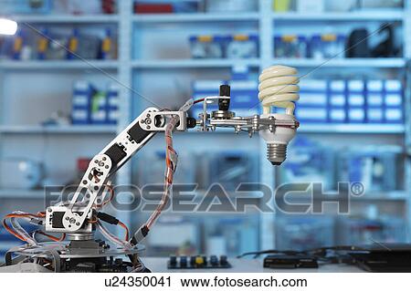 Robotic arm holding light bulb View Large Photo Image Stock Image - Robotic arm holding light bulb. Fotosearch