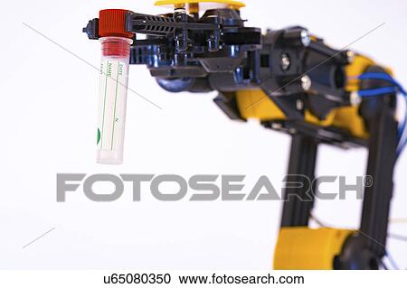Stock Image - Robotic arm holding test tube. Fotosearch