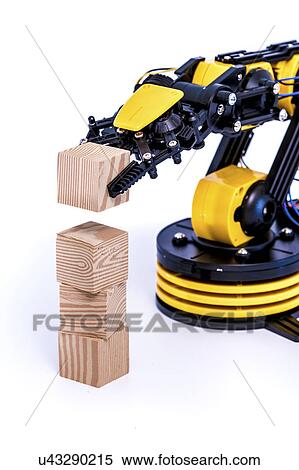 Stock Photography - Robotic arm with wooden blocks. Fotosearch