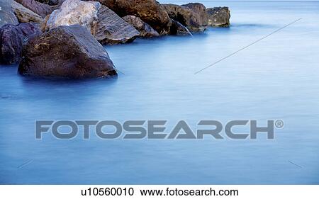 Rocks in the sea View Large Photo Image Stock Image - Rocks in the sea. Fotosearch
