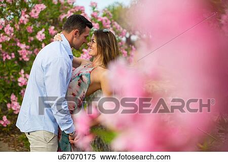 Romantic couple dancing together by blossoms, Majorca, Spain View Large Photo Image Stock Photography - Romantic couple dancing together by blossoms, Majorca, Spain. Fotosearch