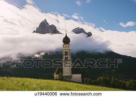 Stock Photograph - San Valentino Church, Schlern-Rosengarten Nature Park, Seiser Alm, South Tyrol, Dolomite Alps, Italy. Fotosearch