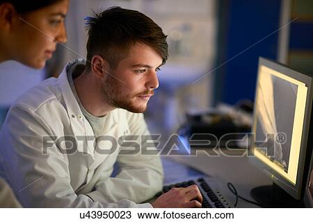 Scientist in laboratory using computer View Large Photo Image Stock Image - Scientist in laboratory using computer. Fotosearch
