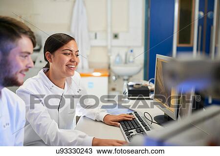 Scientist in laboratory using computer View Large Photo Image Stock Image - Scientist in laboratory using computer. Fotosearch