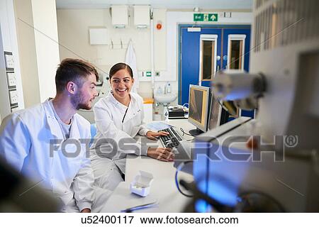 Stock Photo - Scientist in laboratory using computer. Fotosearch