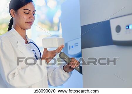 Scientist in laboratory using scientific equipment View Large Photo Image Stock Image - Scientist in laboratory using scientific equipment. Fotosearch