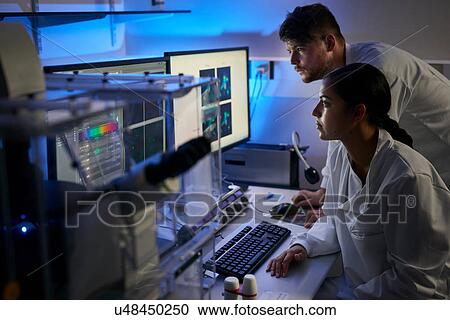 Scientists in laboratory using computer View Large Photo Image Stock Image - Scientists in laboratory using computer. Fotosearch