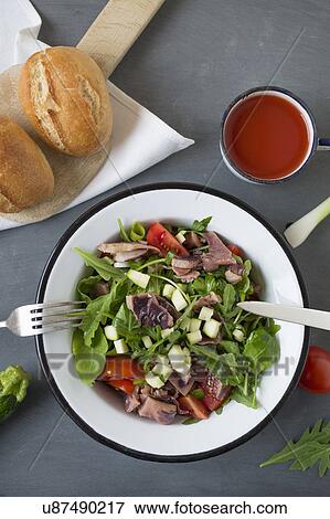Seafood salad in bowl and cherry juice View Large Photo Image Stock Photo - Seafood salad in bowl and cherry juice. Fotosearch