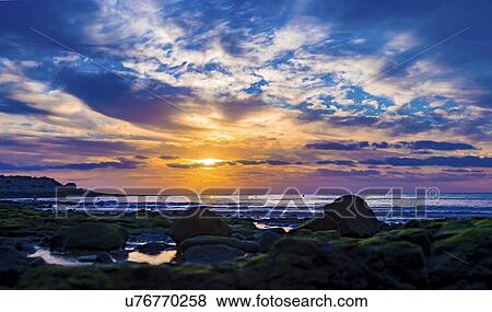 Stock Photo - Seascape at sunset. Fotosearch