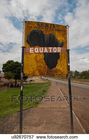 Stock Photo - Sign marking the equator line dividing north and south hemispheres, Nanyuku, Kenya. Fotosearch