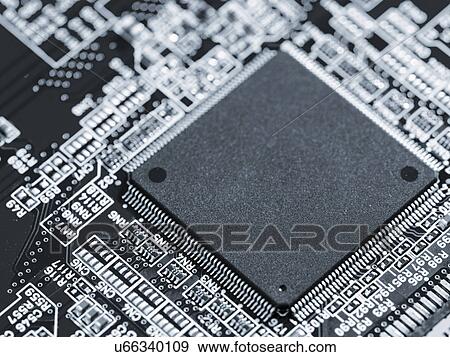 Silicon chip on a circuit board microprocessor View Large Photo Image Stock Photo - Silicon chip on a circuit board microprocessor. Fotosearch