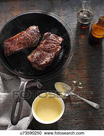 Sirloin steak in frying pan with bearnaise sauce View Large Photo Image Stock Image - Sirloin steak in frying pan with bearnaise sauce. Fotosearch