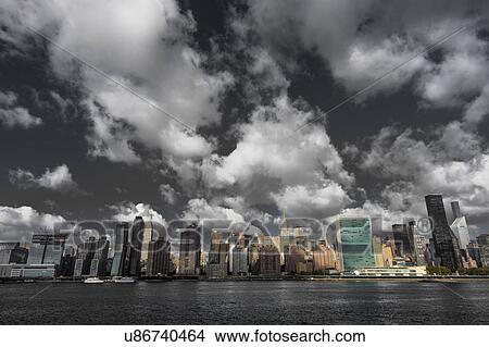 Picture - Skyline of Midtown Manhattan seen from the East River showing the Chrysler Building and the United Nations building, New York. Fotosearch