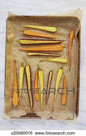 Sliced carrots on baking sheet View Large Photo Image Stock Photograph - Sliced carrots on baking sheet. Fotosearch