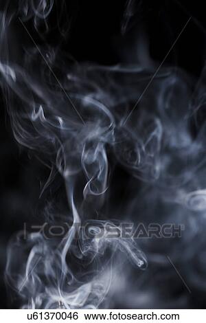 Stock Photograph - Smoke on black background. Fotosearch