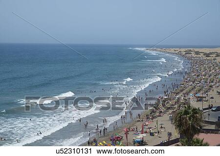Spain, Gran Canaria, Maspalomas, Crowded beach View Large Photo Image Stock Image - Spain, Gran Canaria, Maspalomas, Crowded beach. Fotosearch