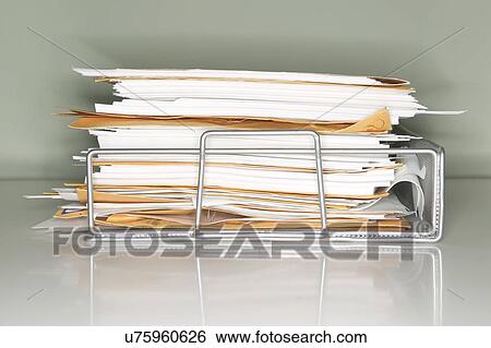 Stock Photograph - Stack of documents on tray. Fotosearch