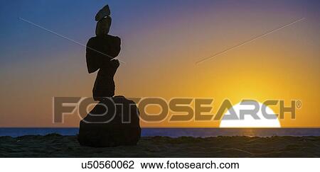 Stack of rocks at sunset View Large Photo Image Stock Image - Stack of rocks at sunset. Fotosearch