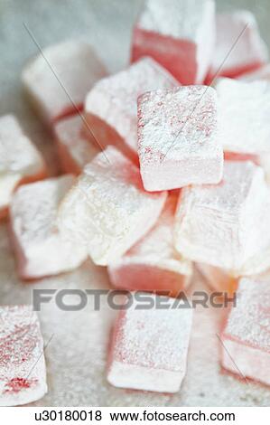 Stacked fresh rose and lemon turkish delight View Large Photo Image Stock Photo - Stacked fresh rose and lemon turkish delight. Fotosearch