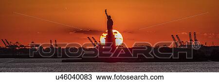 Statue of Liberty sunset. NYC harbor, Manhattan View Large Photo Image Stock Image - Statue of Liberty sunset. NYC harbor, Manhattan. Fotosearch