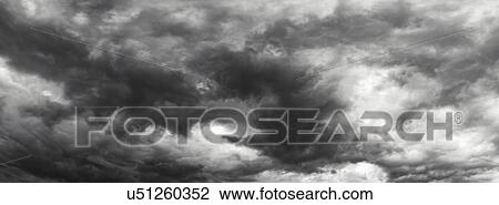 Stock Image - Storm clouds, black and white. Fotosearch