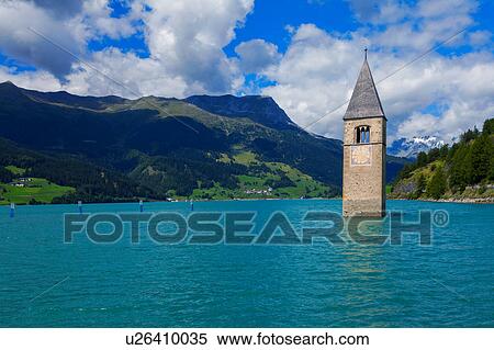 Submerged Curon church bell tower in lake, Vinschgau Valley, South Tyrol, Italy View Large Photo Image Stock Photography - Submerged Curon church bell tower in lake, Vinschgau Valley, South Tyrol, Italy. Fotosearch