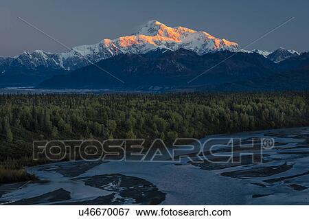 Stock Photo - Sunrise on Mnt Denali, Trapper Creek pullout view, Alaska near Mount Denali Lodge. Fotosearch