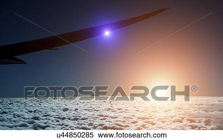 Stock Photography - Sunset over clouds. Fotosearch