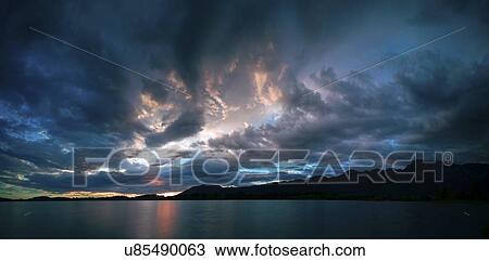 Stock Image - Sunset over lake. Fotosearch