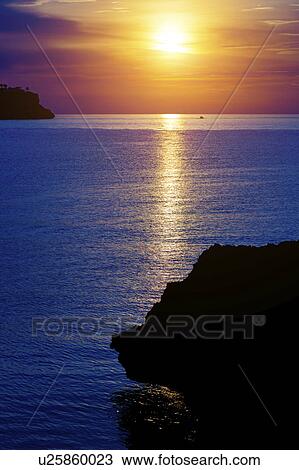 Stock Image - Sunset over the sea, Greece. Fotosearch