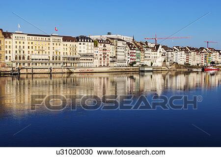 Stock Image - Switzerland, Basel, Basel-Stadt, Houses by Rhine River. Fotosearch