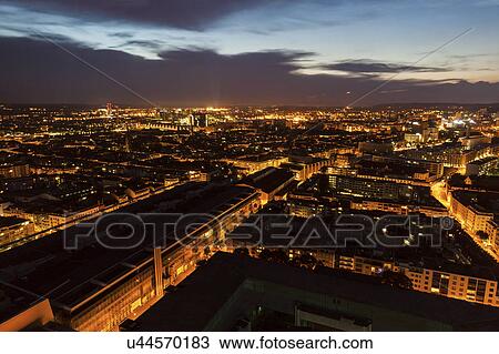 Stock Image - Switzerland, Basel, Basel-Stadt, Cityscape at dusk. Fotosearch