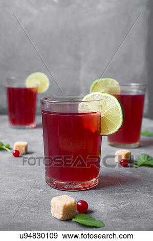 Stock Photo - Tea in glasses decorated with lemon slices. Fotosearch