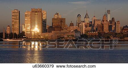 The skyscrapers of Philadelphia rise above the Delaware River at sunrise View Large Photo Image Stock Photo - The skyscrapers of Philadelphia rise above the Delaware River at sunrise. Fotosearch