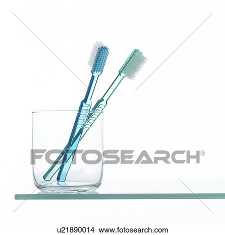 Toothbrushes in glass on shelf View Large Photo Image Picture - Toothbrushes in glass on shelf. Fotosearch