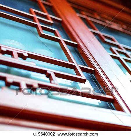 Stock Image - Traditional red Japanese door. Fotosearch